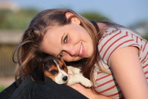 girl with pet puppy dog