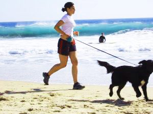 Women running with a dog